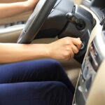 woman driver starting the car