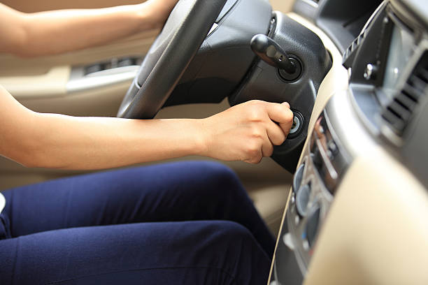 woman driver starting the car