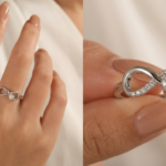 Close-up of a white gold infinity ring featuring a round diamond and pavé accents, worn on a hand and displayed in detail.