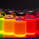 Vials containing brightly colored fluorescent quantum dots and nanoparticles for biomedical research and nanotechnology applications