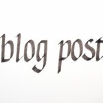 Blog post being written by hand. Calligraphy closeup.