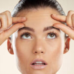 Does Forehead Lift improve deep frown lines over time
