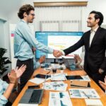 imgi_17_cheerful-meeting-room-businesspeople-celebrate-meeting-room-habiliment_31965-685547