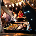 Asian man are cooking for a group of friends to eat barbecue