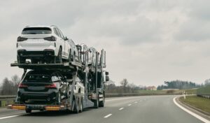 car-transporter-carries-new-luxury-vehicles-along-motorway-back-view-trailer-big-car-carrier-truck-new-sport-german-cars-delivery-dealership-truck-new-powerful-new-vehicles_782515-7966 (2)