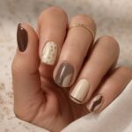 cream nails with gold
