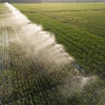 Aerial view of agricultural watering pivot irrigation system.