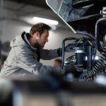 Professional truck service mechanic working.