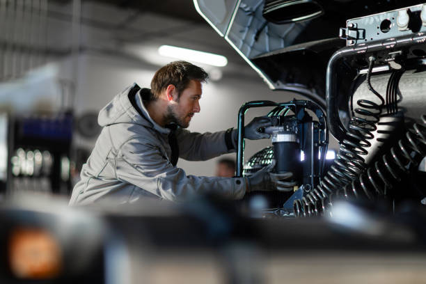 Professional truck service mechanic working.